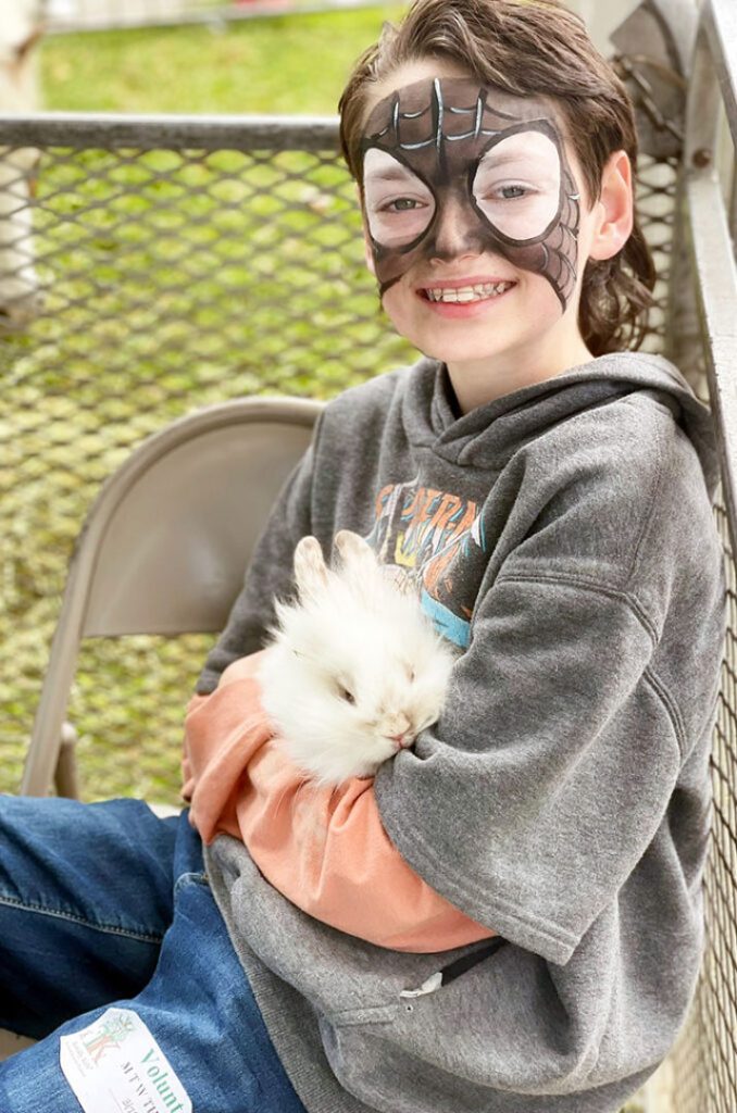 facepainted-child-holding-bunny-720x1024